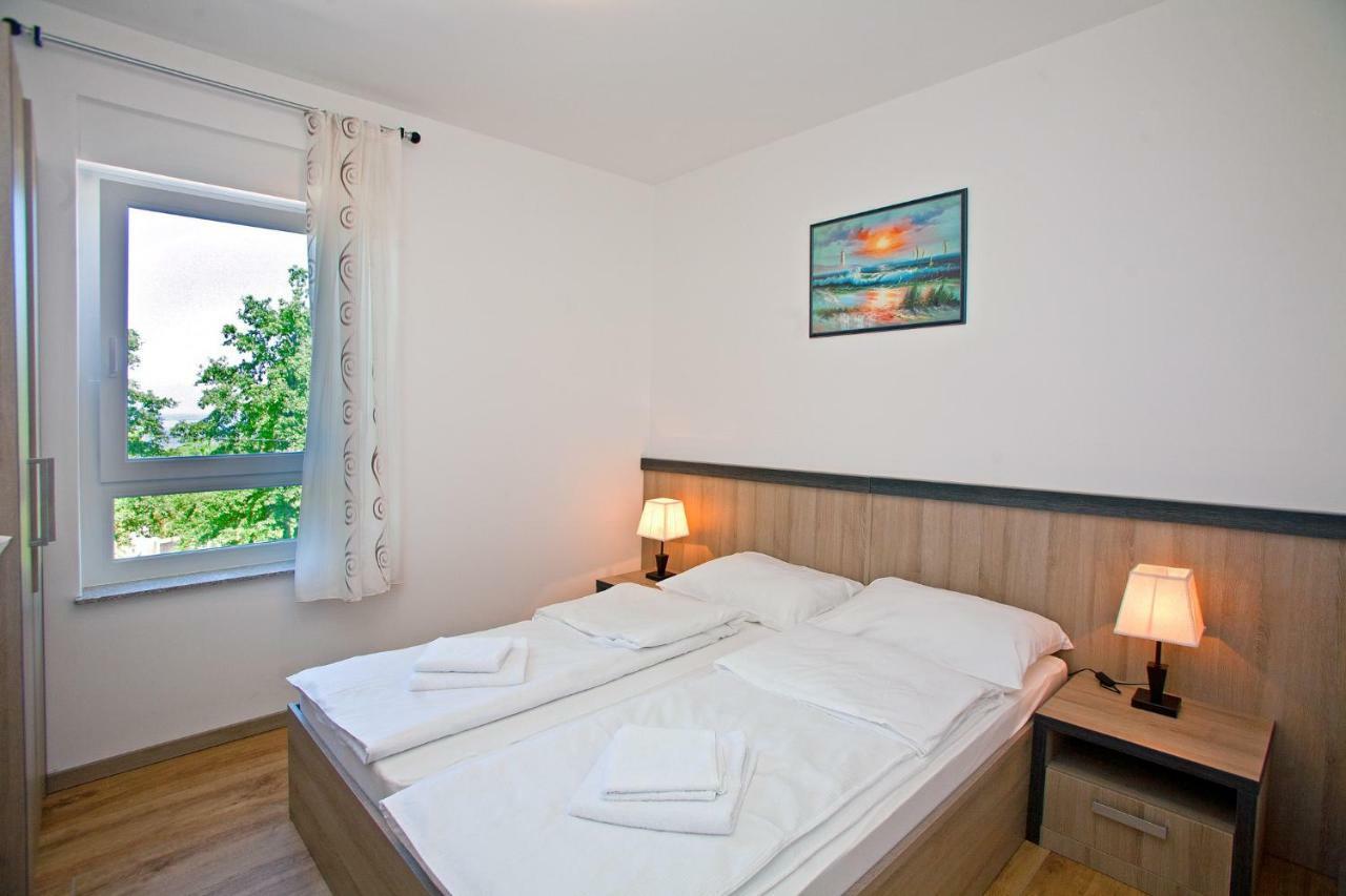 Apartments Maslina II Njivice Buitenkant foto